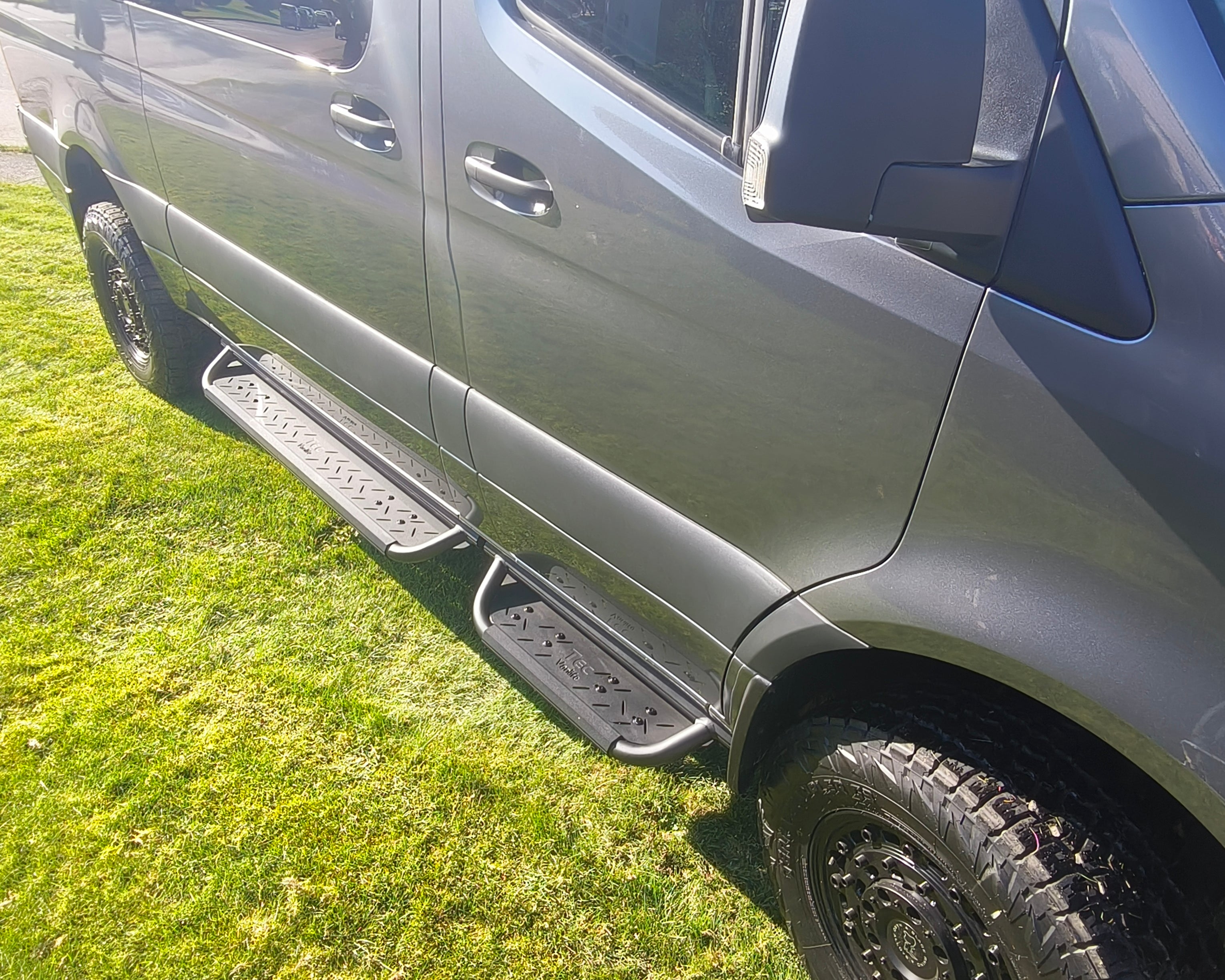 Coated aluminum modular drop down running boards for Sprinter vans.