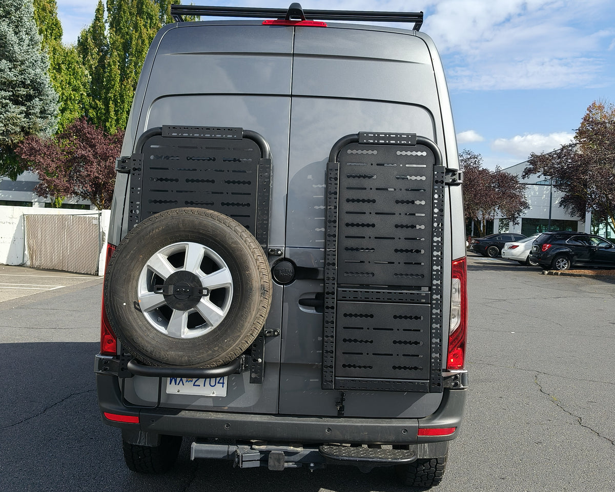 Driver side gear rack carrying a spare tire, paired with passenger side gear rack