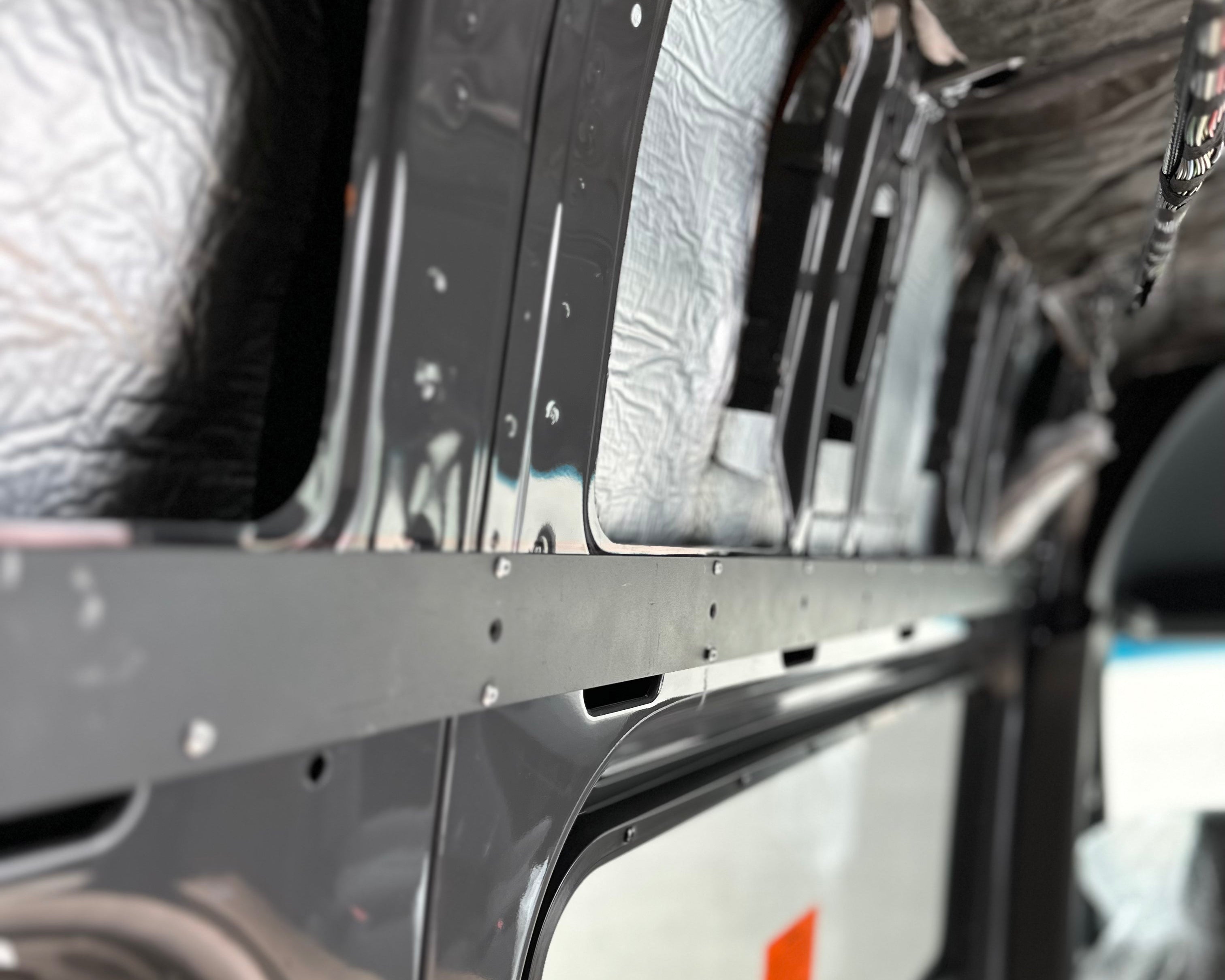 Durable L-track back framing with pre-drilled holes for easy installation and precise L-track alignment.