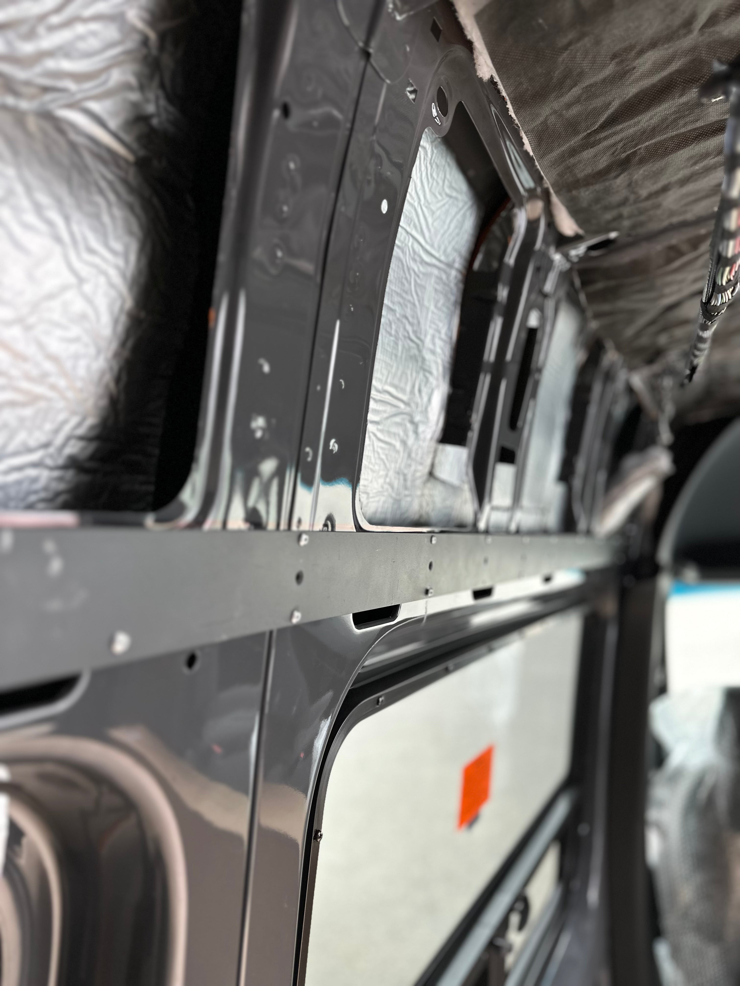 Durable L-track back framing with pre-drilled holes for easy installation and precise L-track alignment.