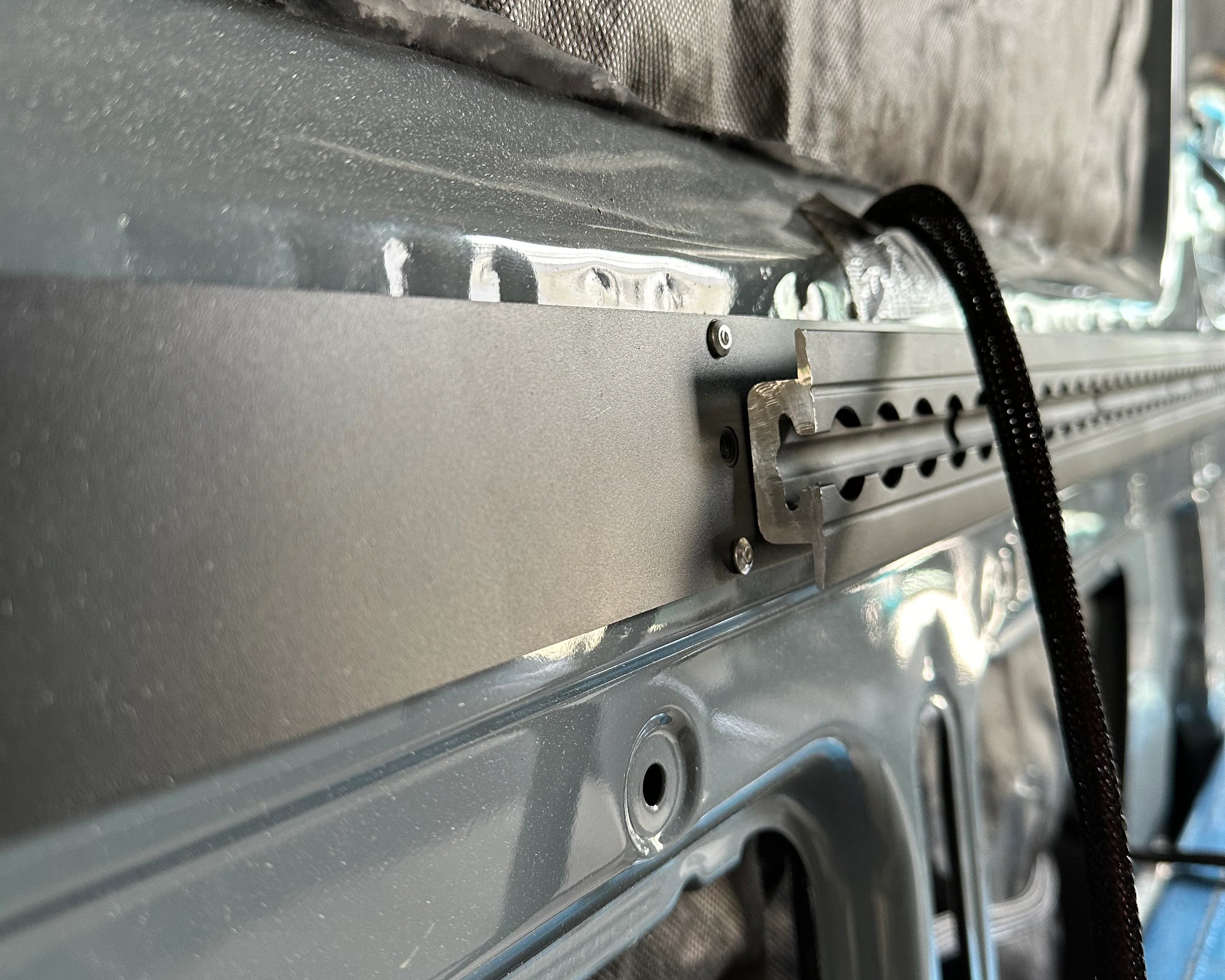 L-track back framing for mounting heavy cabinetry and gear.