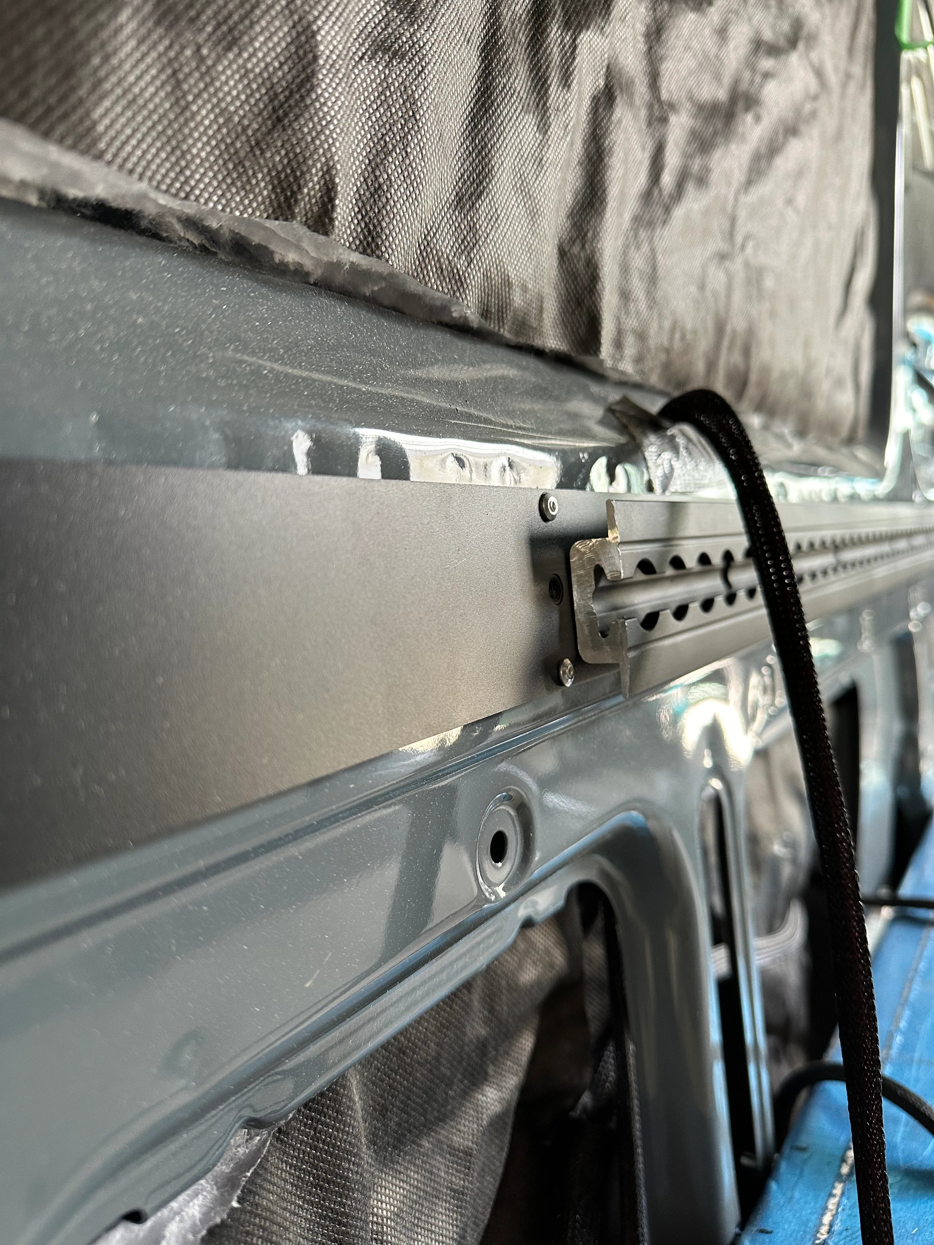 L-track back framing for mounting heavy cabinetry and gear.