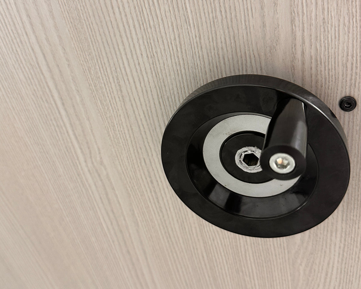 Close-up of the manual elevator bed hand crank