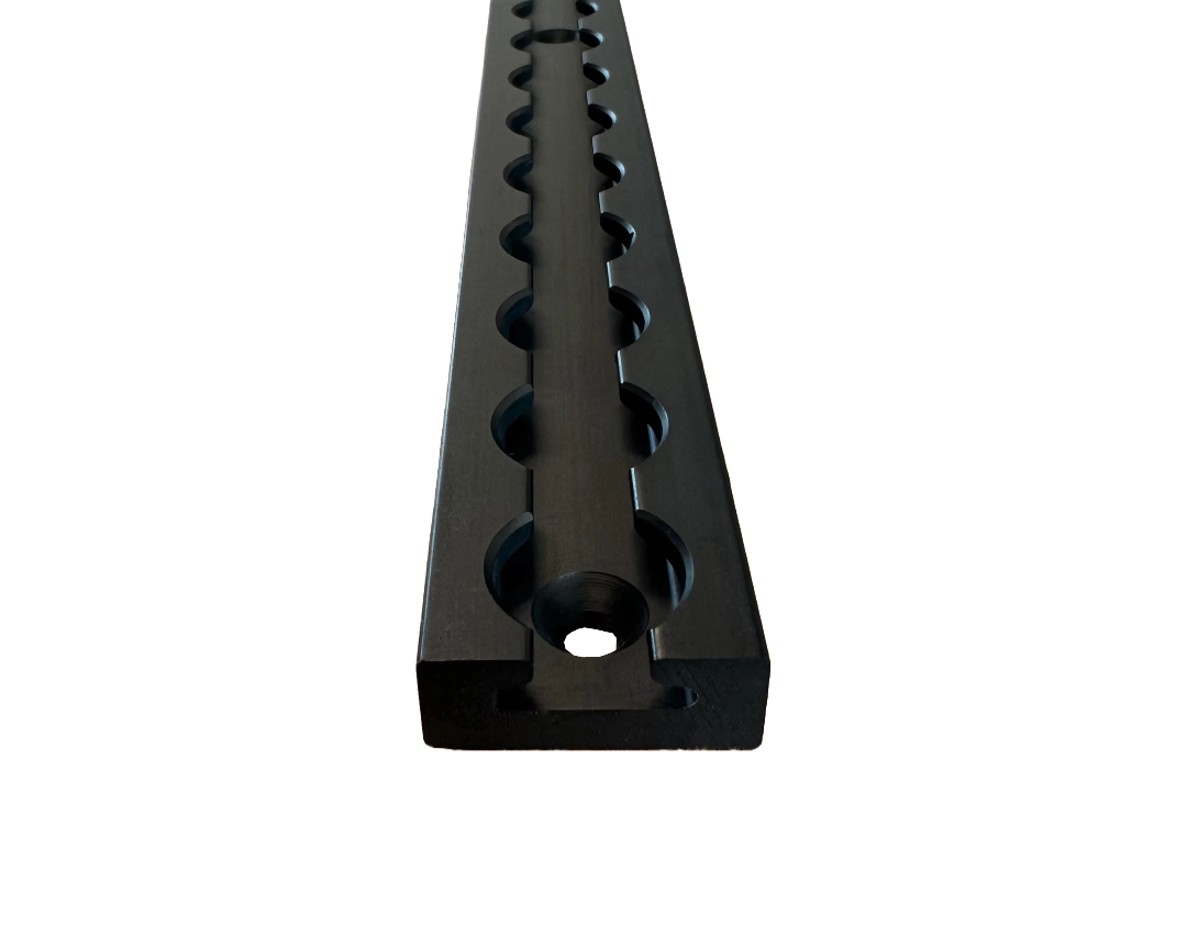 Aluminum L-track with multiple mounting holes.