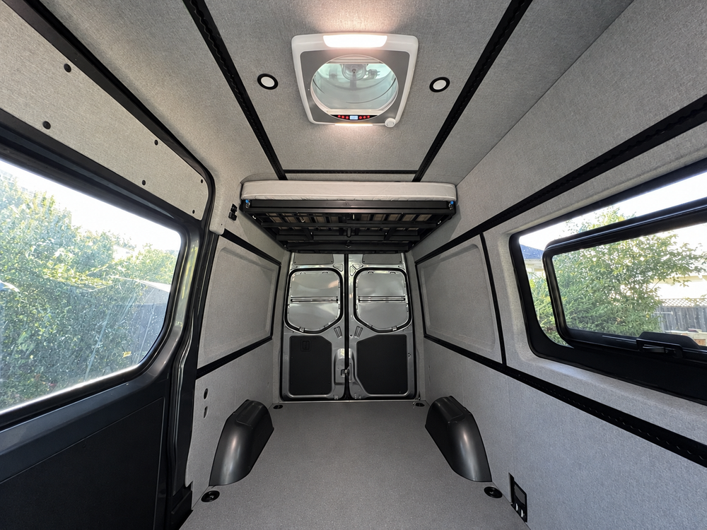 Sprinter ceiling panels and L-Track with roof vent cutout, view toward the rear doors