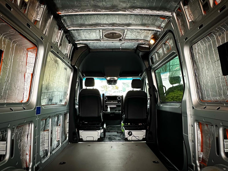 Sprinter interior lined with Duck Liner, view toward the cab