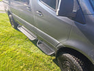 Coated aluminum modular drop down running boards for Sprinter vans.