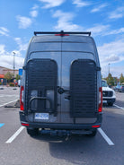 Driver side gear rack with top panel and tire carrier, paired with passenger side gear rack