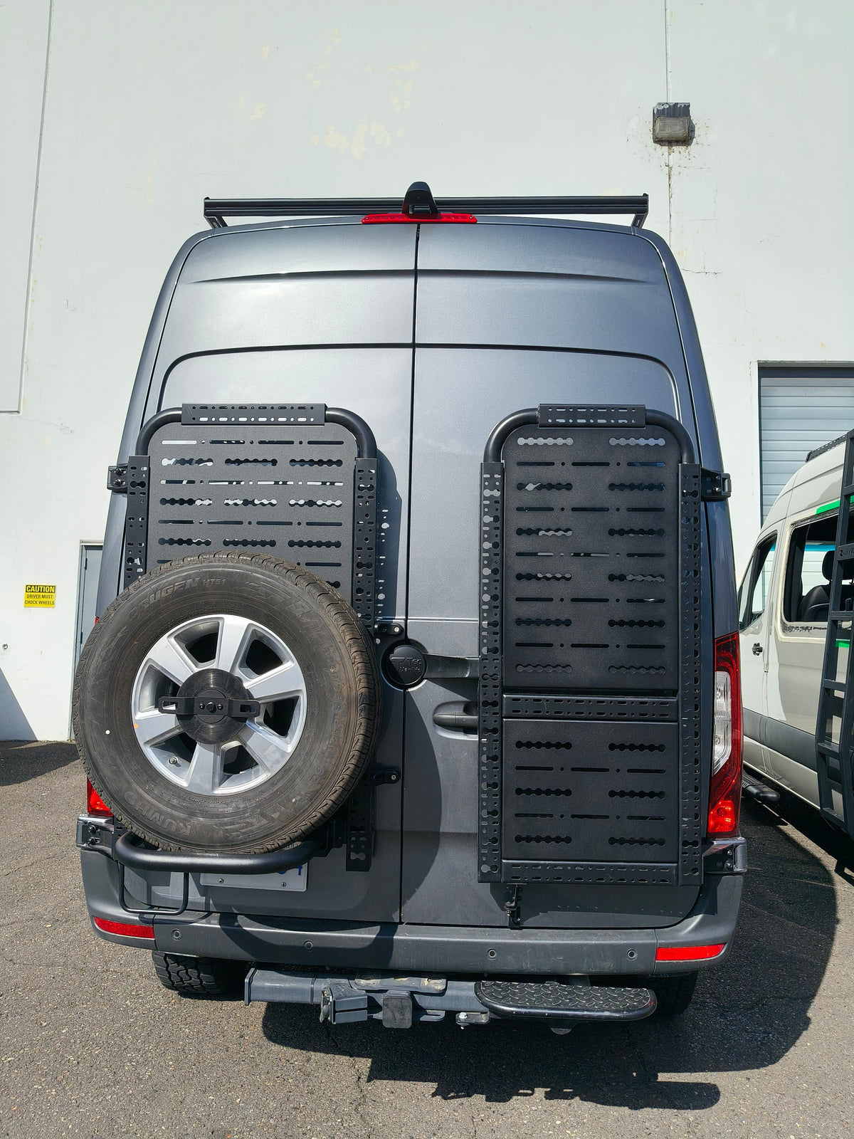 Sprinter rear doors with spare tire on driver side gear rack and passenger side gear rack